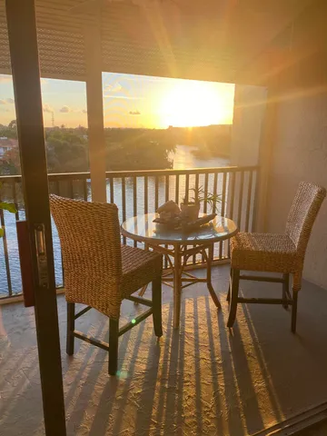 a view of a balcony with chairs