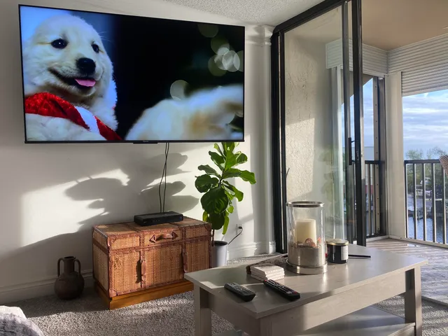 a view of balcony with wooden floor and outdoor seating