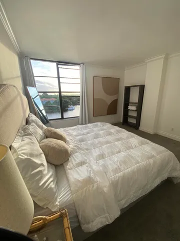 a room with water heater and wooden floor