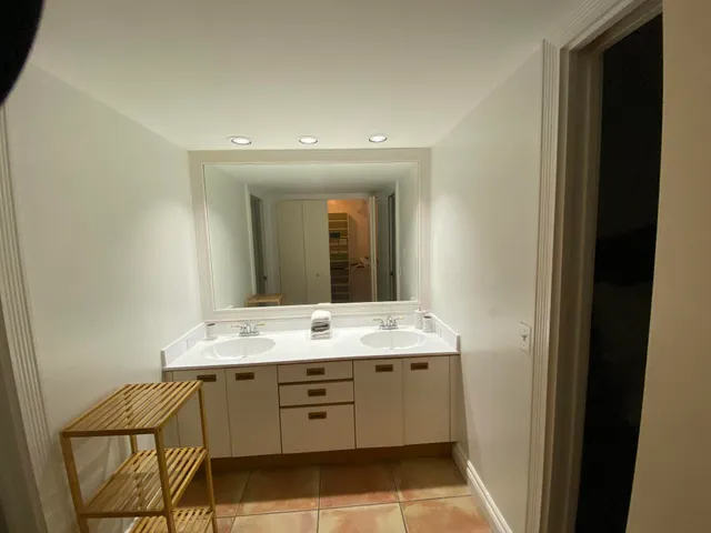 a bathroom with a bath tub with a shower