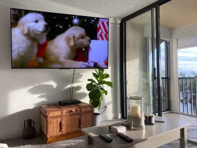 a living room with furniture and a flat screen tv