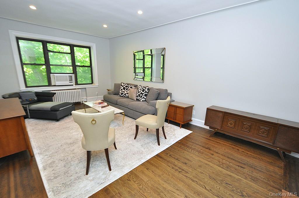 143 Garth Road, Unit 4P Scarsdale, NY 10583 - Photo 3 of 44 Bright and Sunny living room overlooks Garth Woods and has recessed lighting and hardwood floors.