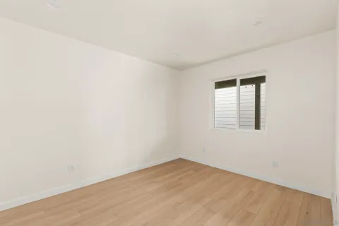 a view of a kitchen with wooden floor