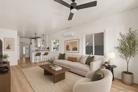 a kitchen with stainless steel appliances white cabinets and a stove top oven