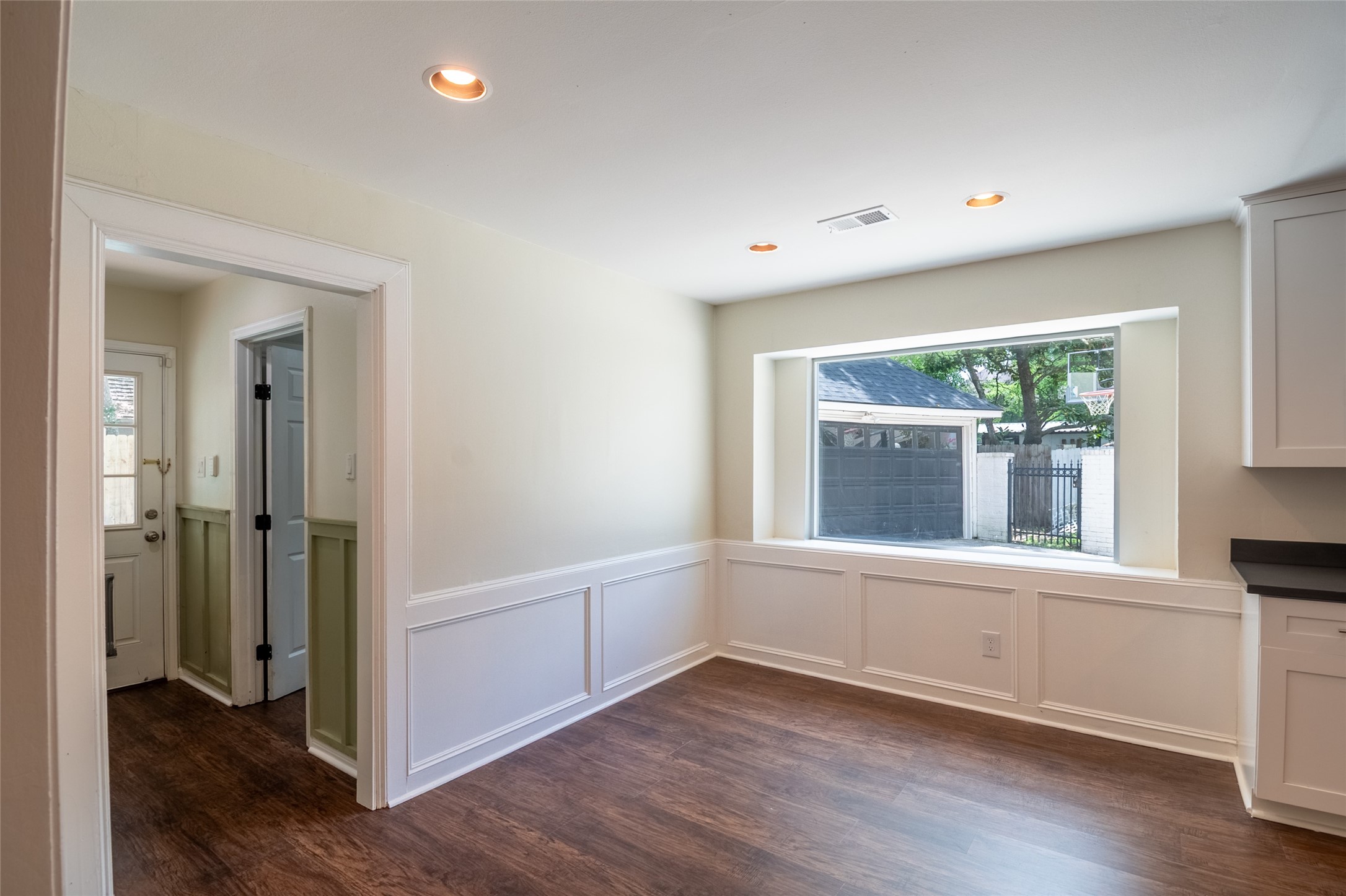 5607 Court Of York Houston, TX 77069 - Photo 13 of 45 wooden floor in an empty room with a window