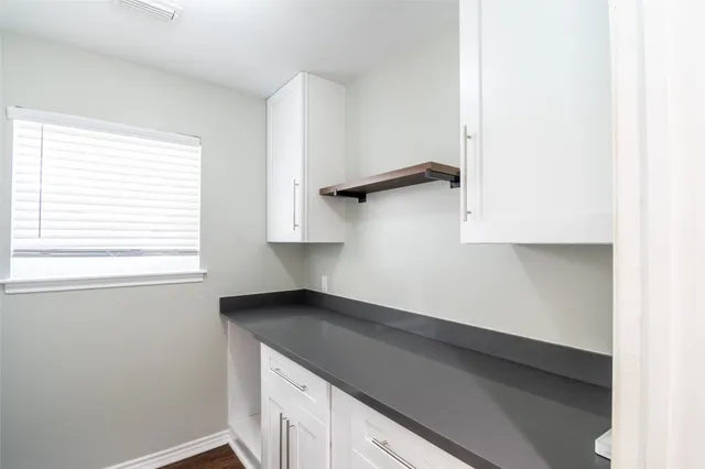 a kitchen with a sink and a window