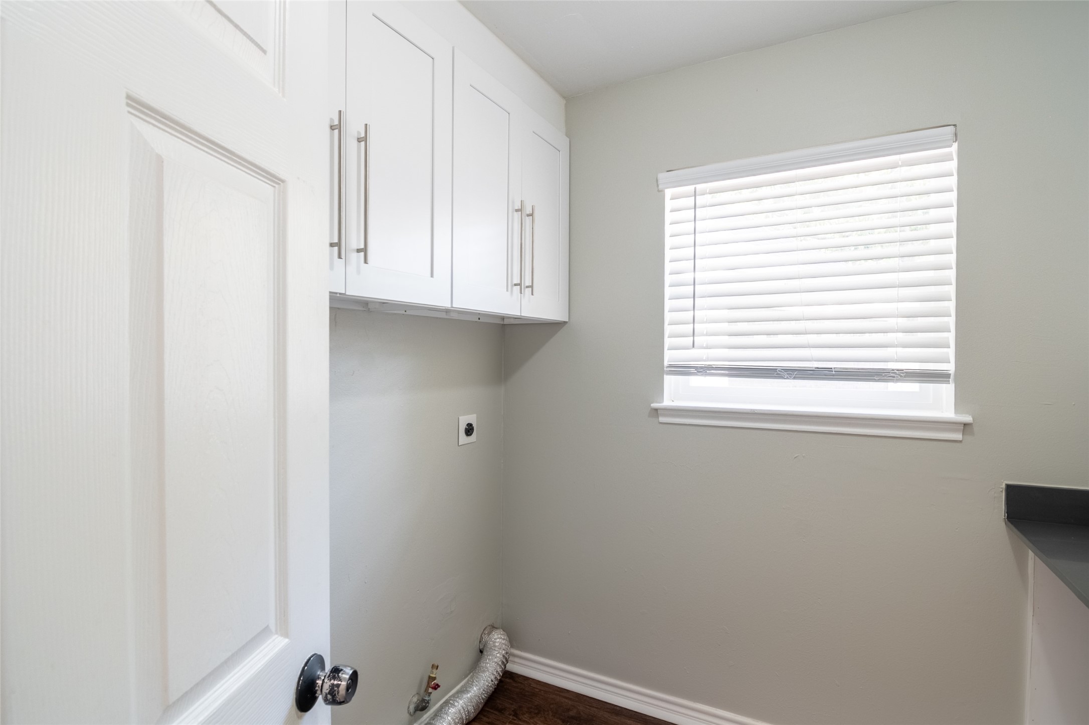 5607 Court Of York Houston, TX 77069 - Photo 21 of 45 a room with a window and a white cabinet