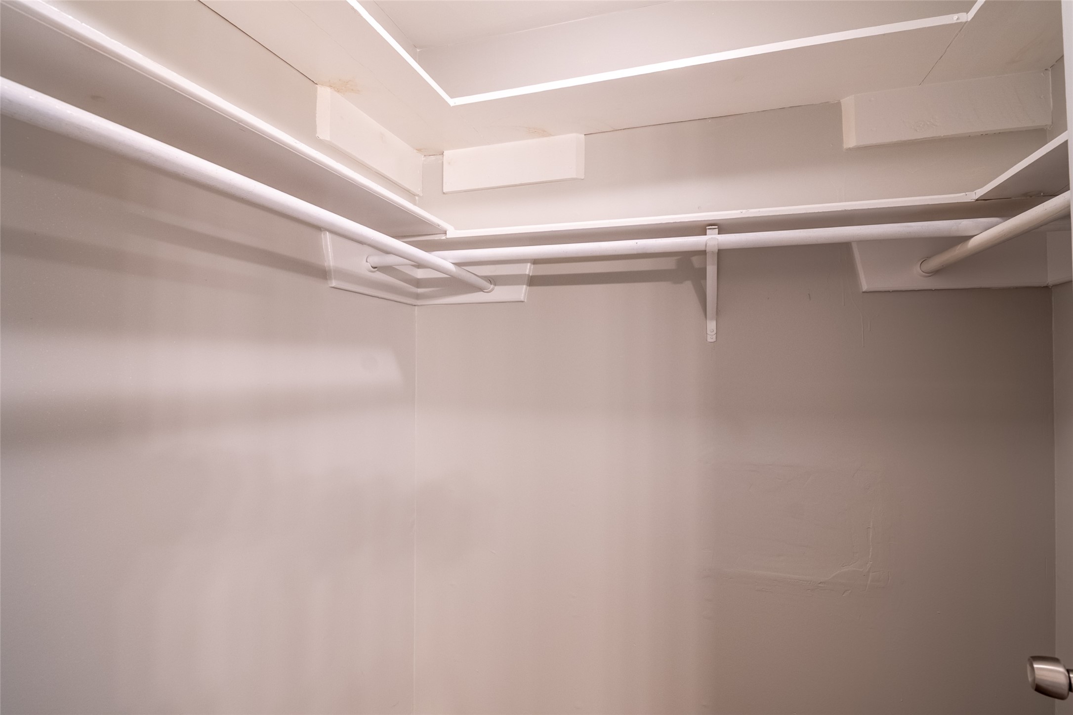 5607 Court Of York Houston, TX 77069 - Photo 27 of 45 a view of a room with racks on the wall