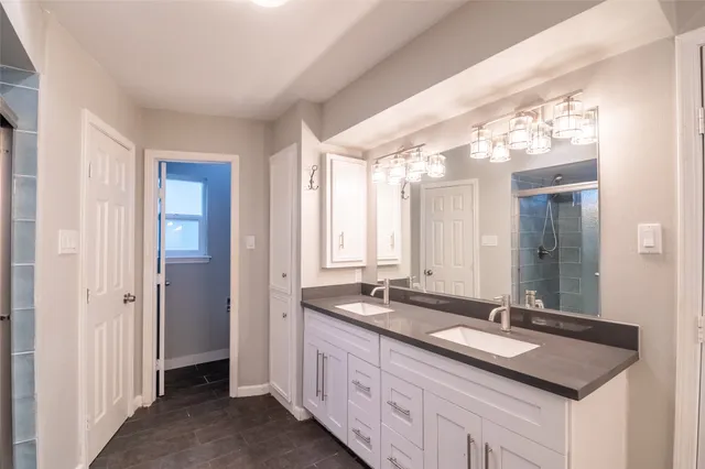 a view of a yard with a house and a large tree