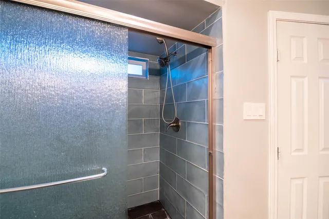 a view of entryway and gallery with wooden floor