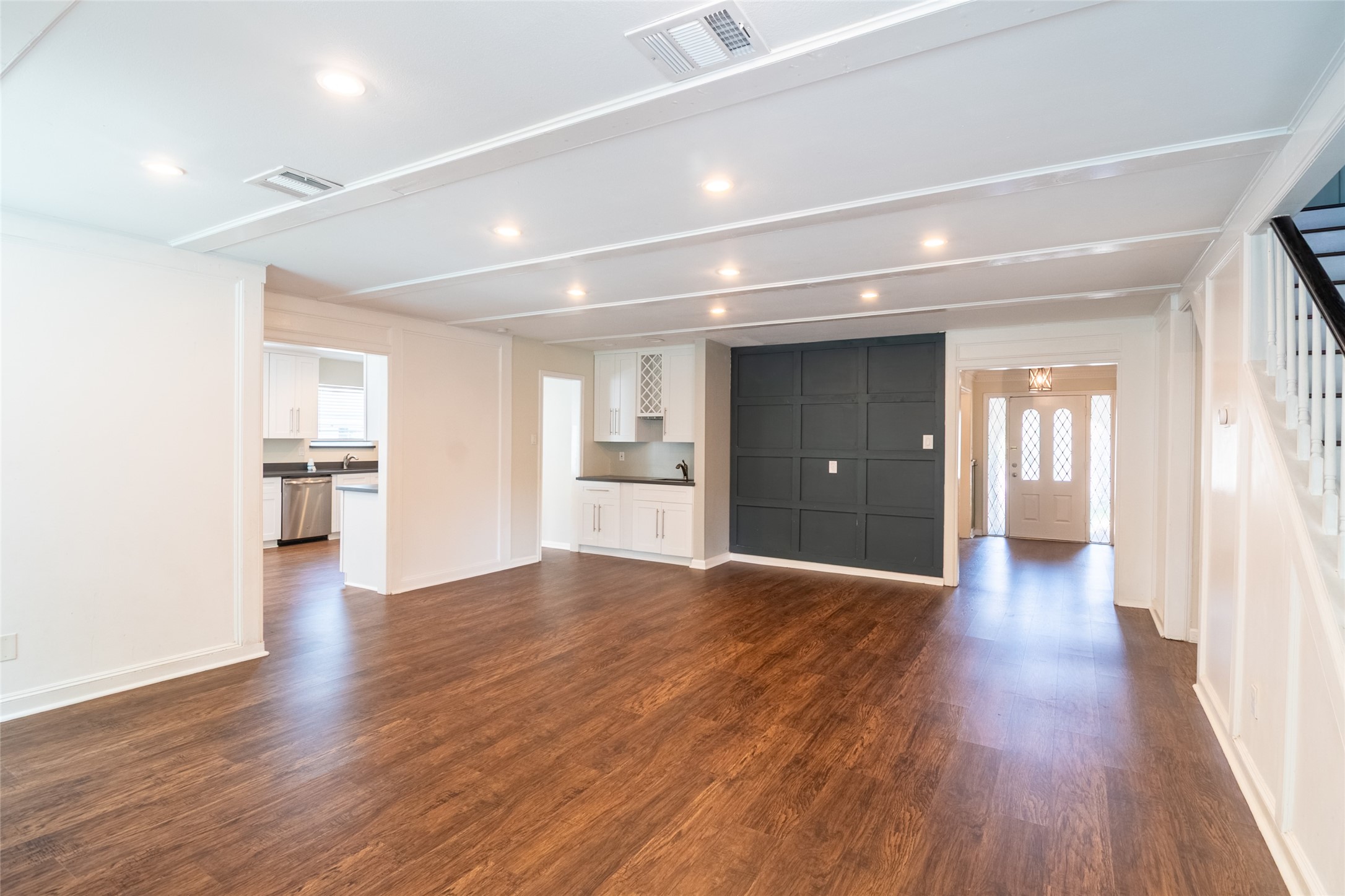 5607 Court Of York Houston, TX 77069 - Photo 9 of 45 a view of an empty room with wooden floor and a window