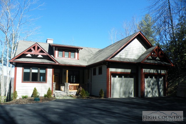 1459 Pine Ridge Road Beech Mountain, NC 28604 - Photo 1 of 25 a front view of a house with yard