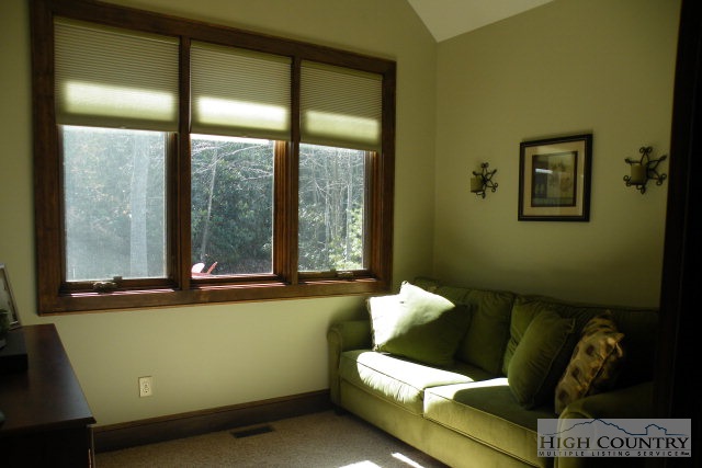 1459 Pine Ridge Road Beech Mountain, NC 28604 - Photo 24 of 25 a living room with furniture and a window