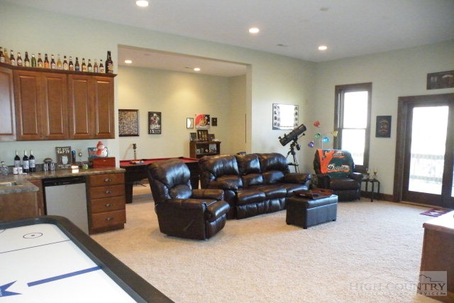 1459 Pine Ridge Road Beech Mountain, NC 28604 - Photo 6 of 25 a living room with furniture and a wooden floor