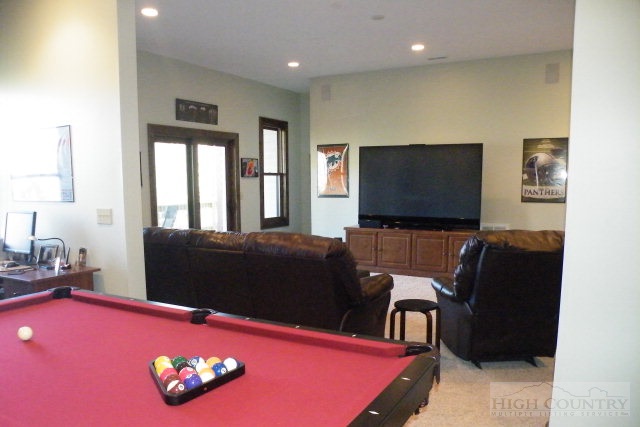 1459 Pine Ridge Road Beech Mountain, NC 28604 - Photo 8 of 25 a living room with furniture and a flat screen tv