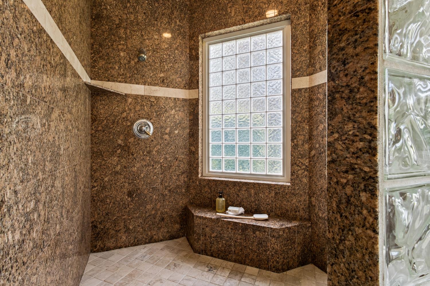 9003 Cedar Ridge Drive Granite Bay, CA 95746 - Photo 22 of 65 a bath tub sitting in front of a bathroom