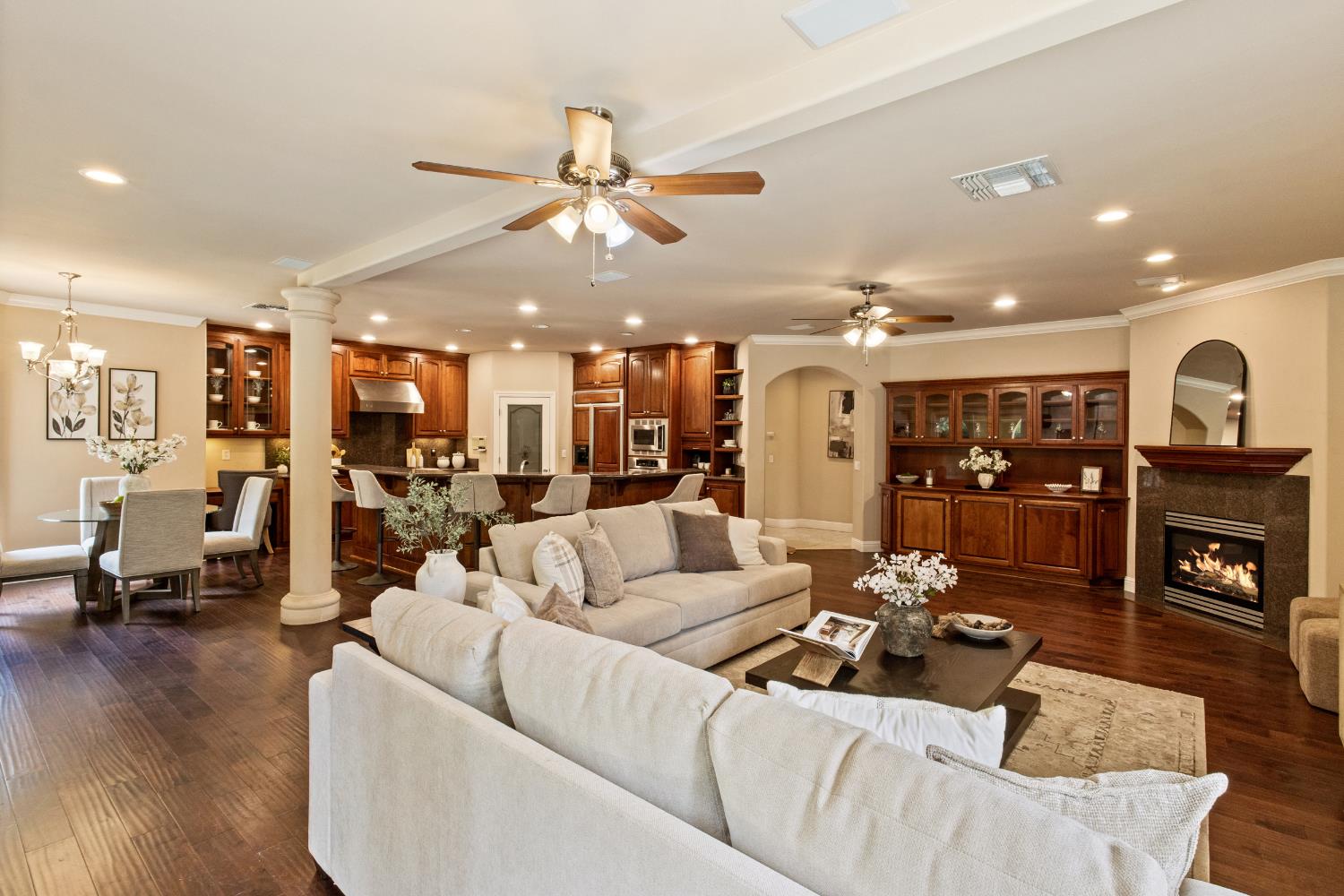 9003 Cedar Ridge Drive Granite Bay, CA 95746 - Photo 36 of 65 a living room with furniture kitchen view and a chandelier
