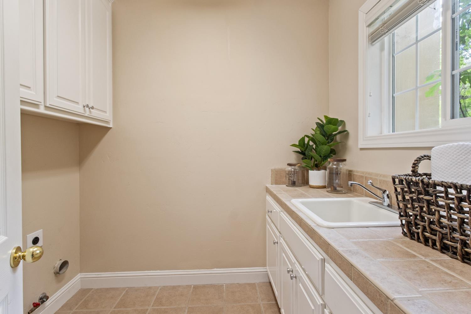 9003 Cedar Ridge Drive Granite Bay, CA 95746 - Photo 37 of 65 a bathroom with a granite countertop sink a mirror and a bathtub