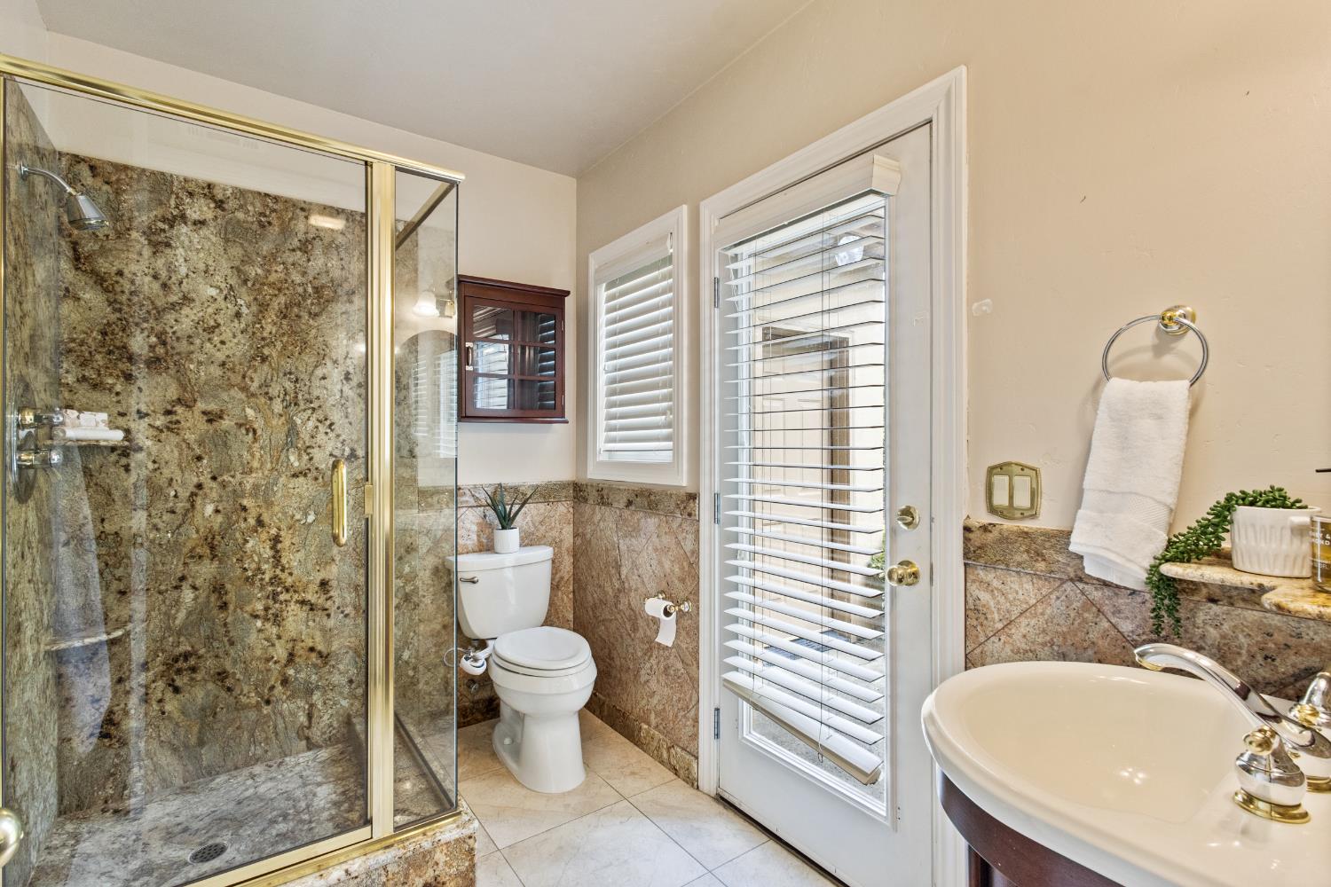 9003 Cedar Ridge Drive Granite Bay, CA 95746 - Photo 38 of 65 a bathroom with a sink a toilet and shower