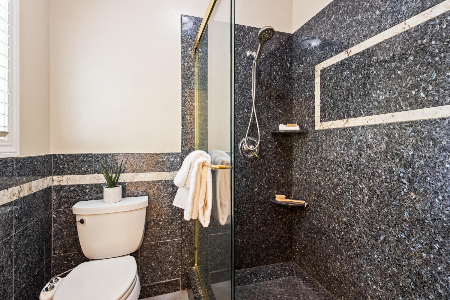 9003 Cedar Ridge Drive Granite Bay, CA 95746 - Photo 40 of 65 a bathroom with a toilet a sink and mirror