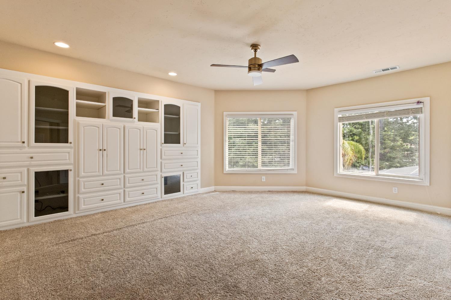 9003 Cedar Ridge Drive Granite Bay, CA 95746 - Photo 44 of 65 a view of an empty room with a fireplace and a window