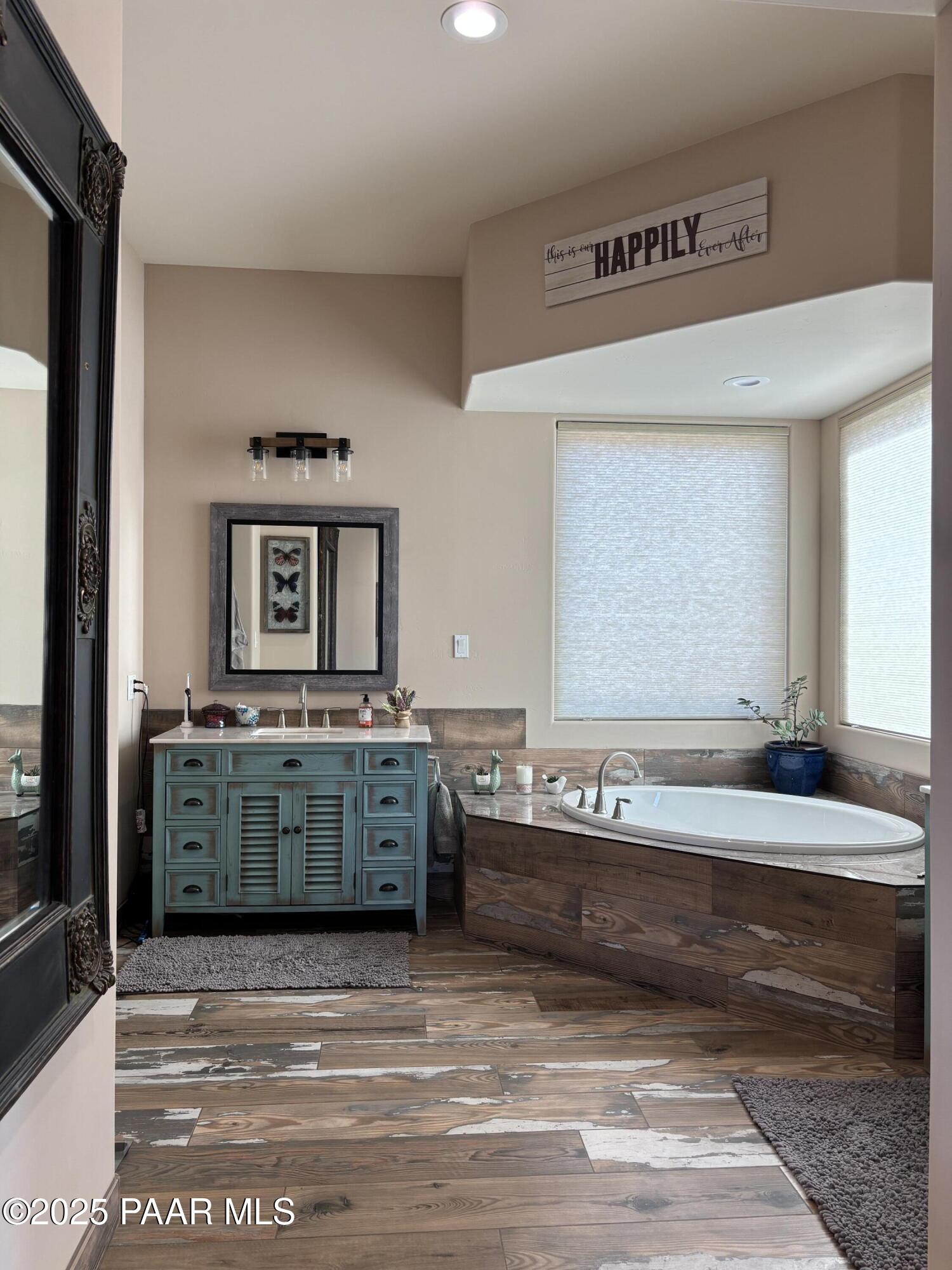 14994 North Hope Rose Road Prescott, AZ 86305 - Photo 11 of 33 a bathroom with a tub sink and mirror