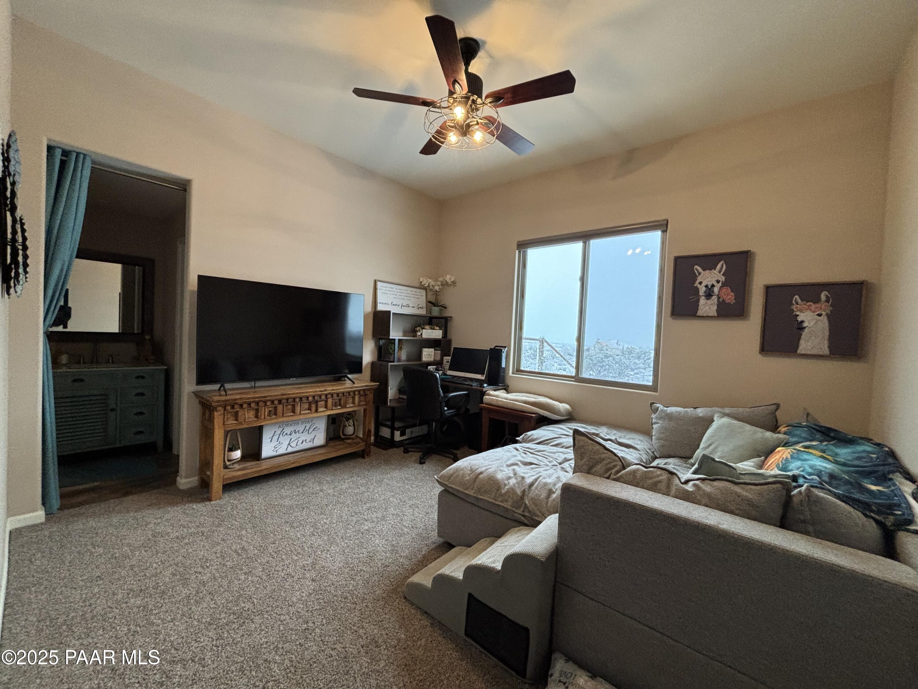 14994 North Hope Rose Road Prescott, AZ 86305 - Photo 16 of 33 a living room with furniture and a flat screen tv