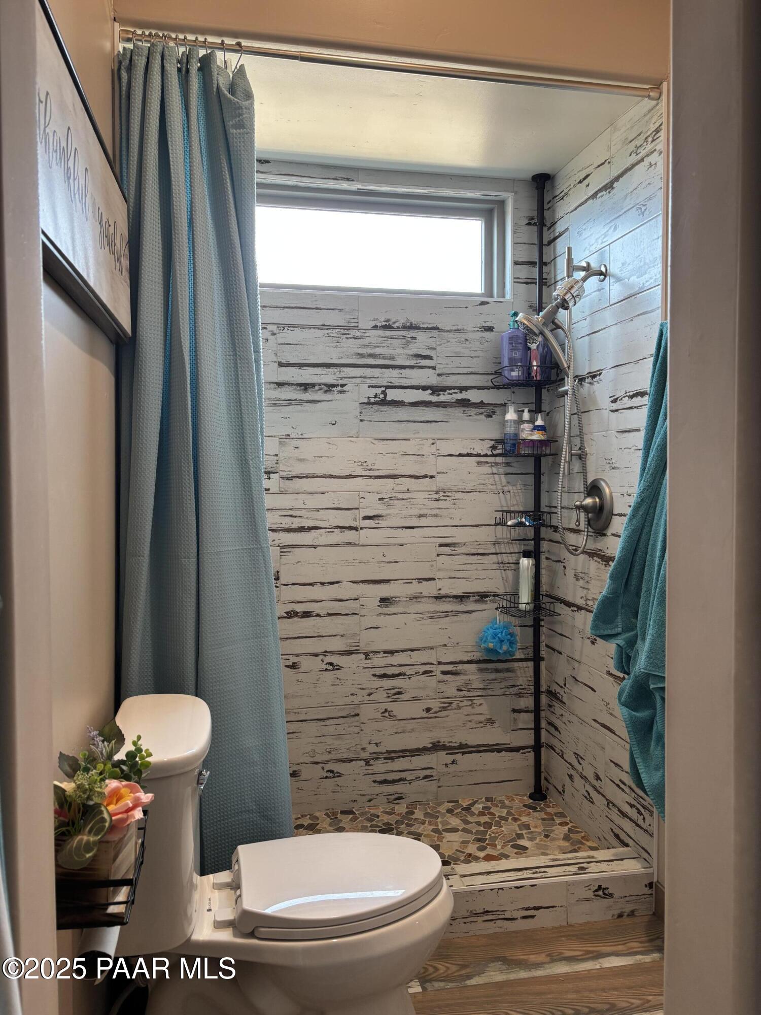 14994 North Hope Rose Road Prescott, AZ 86305 - Photo 18 of 33 a bathroom with a toilet and a shower