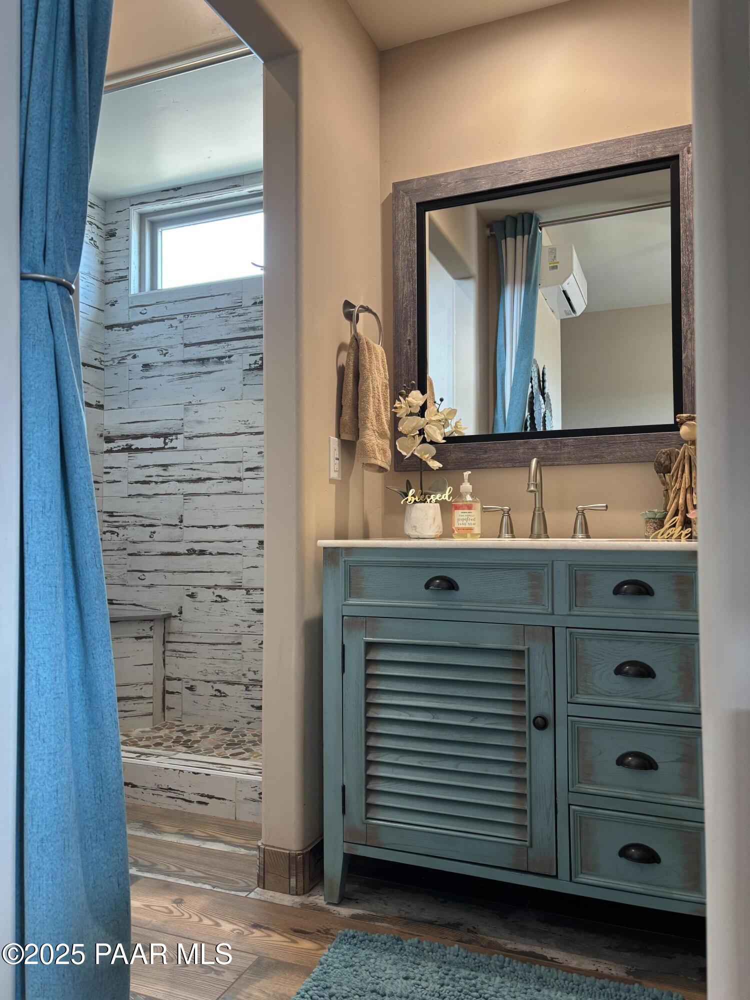14994 North Hope Rose Road Prescott, AZ 86305 - Photo 20 of 33 a bathroom with a sink a mirror and a vanity