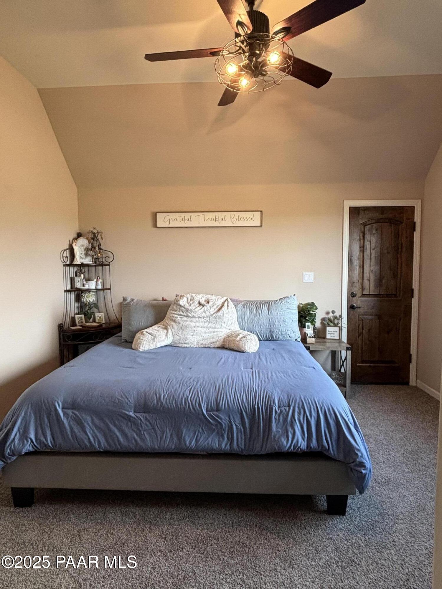 14994 North Hope Rose Road Prescott, AZ 86305 - Photo 22 of 33 a bedroom with a bed and a ceiling fan