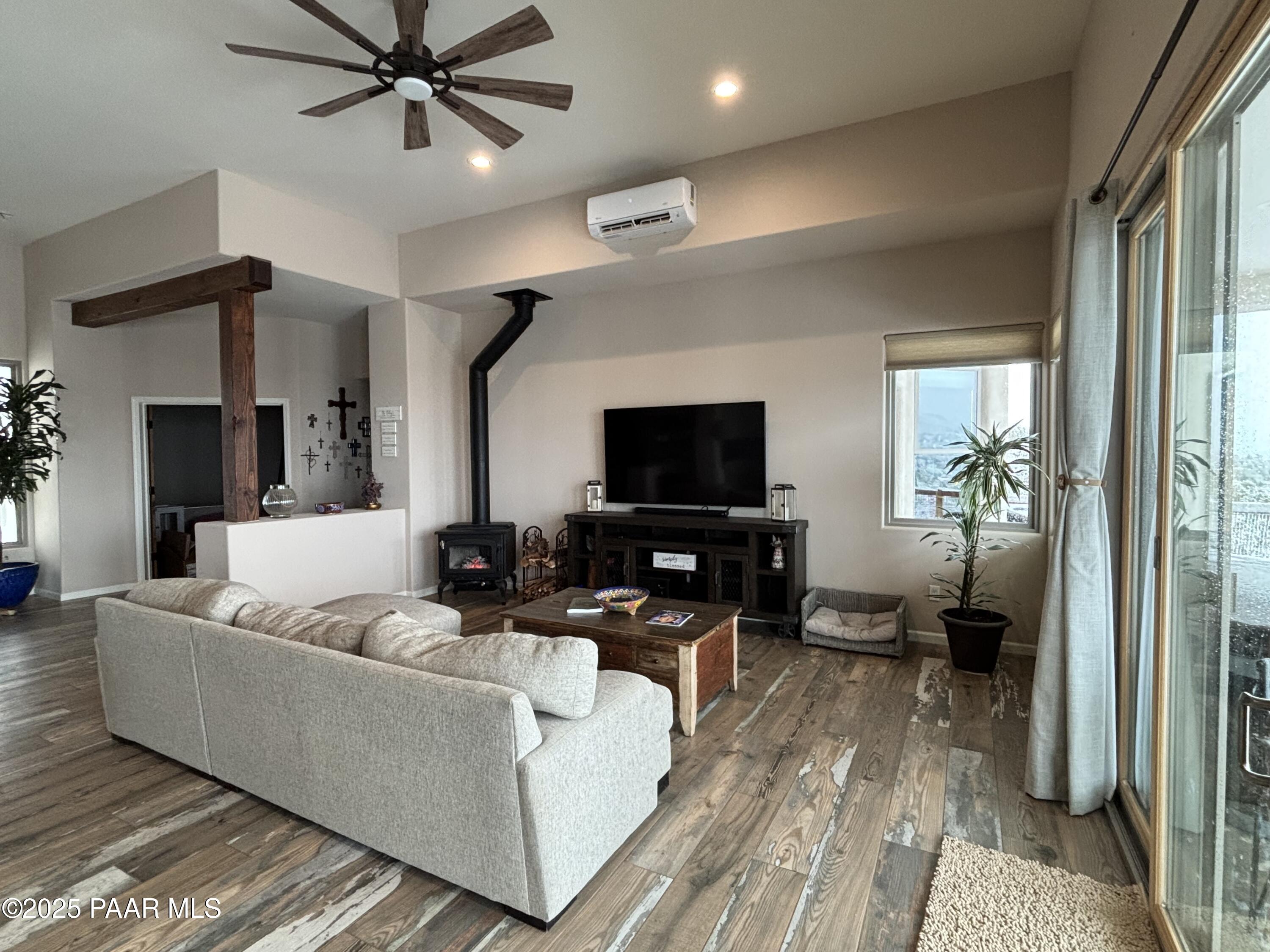 14994 North Hope Rose Road Prescott, AZ 86305 - Photo 3 of 33 a living room with furniture and a flat screen tv