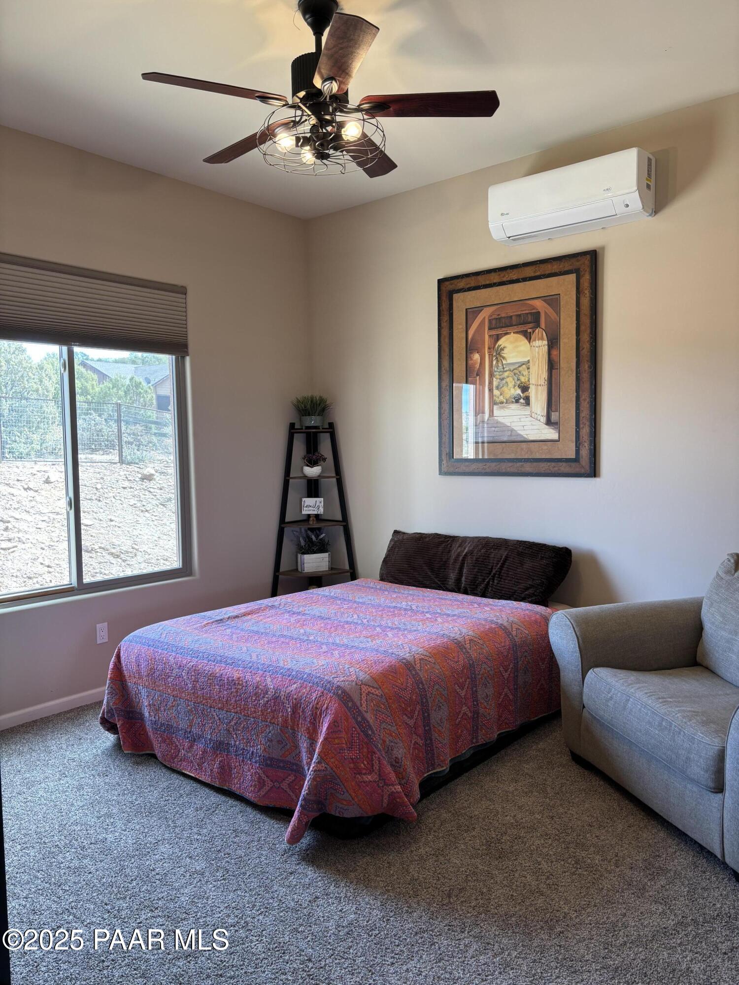 14994 North Hope Rose Road Prescott, AZ 86305 - Photo 8 of 33 a bedroom with a bed and a window