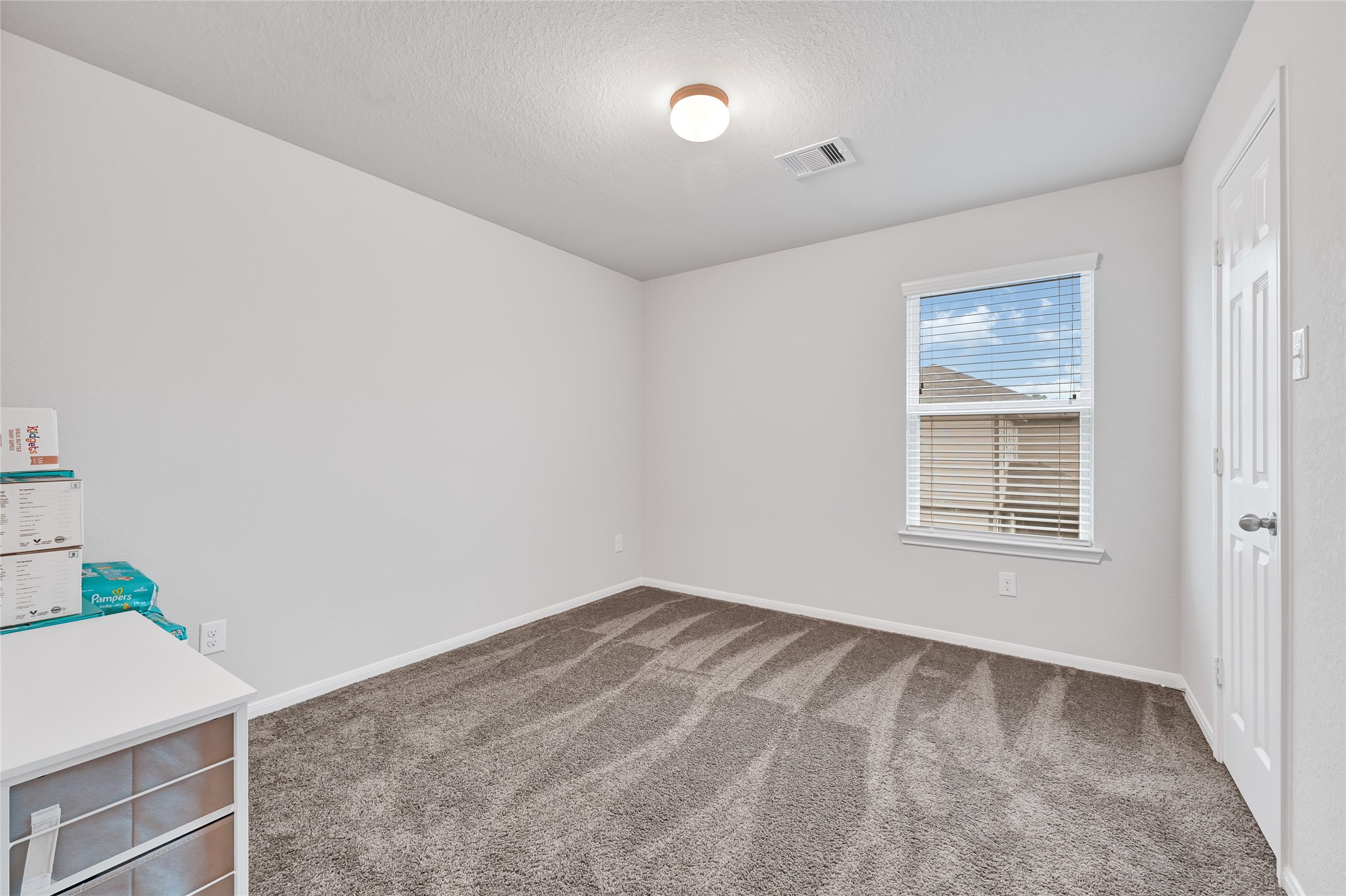 11346 Cascading Stream Way Houston, TX 77044 - Photo 16 of 24 a view of an empty room with a window