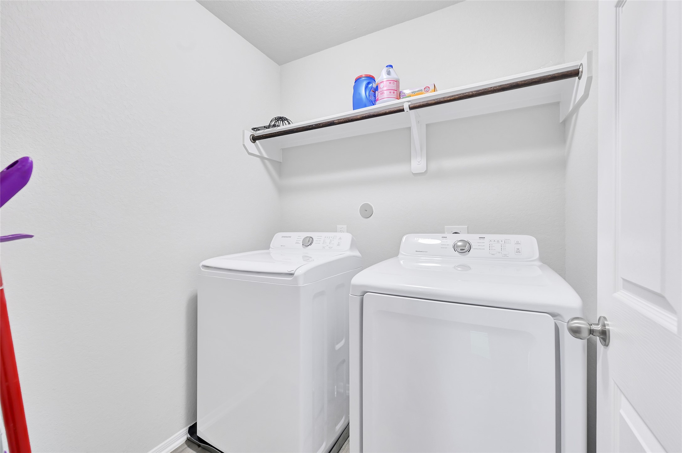 11346 Cascading Stream Way Houston, TX 77044 - Photo 19 of 24 a utility room with dryer and washer