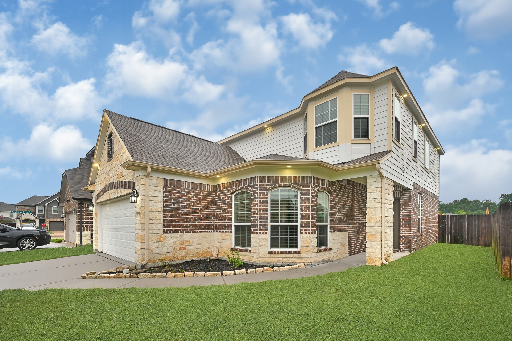 11346 Cascading Stream Way Houston, TX 77044 - Photo 2 of 24 a front view of a house with a yard