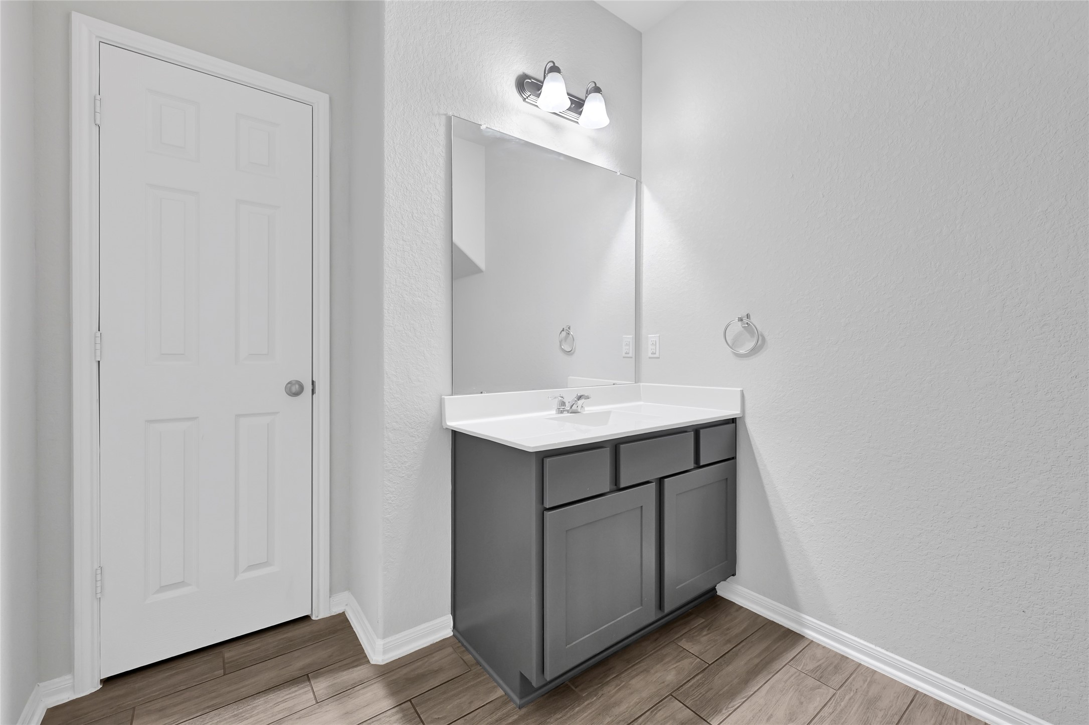 11346 Cascading Stream Way Houston, TX 77044 - Photo 22 of 24 a bathroom with a sink and a mirror