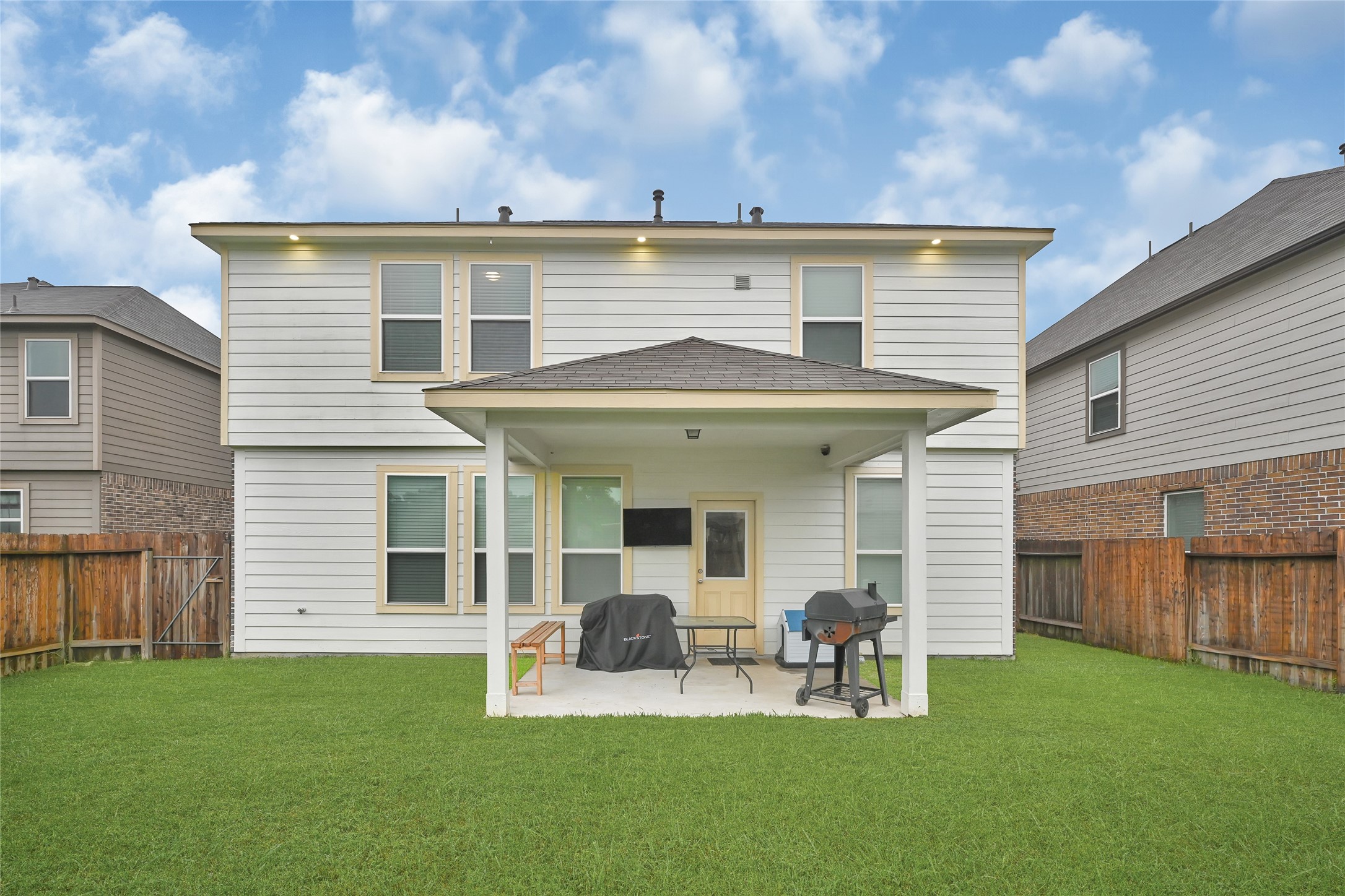 11346 Cascading Stream Way Houston, TX 77044 - Photo 23 of 24 a front view of house with a garden and patio