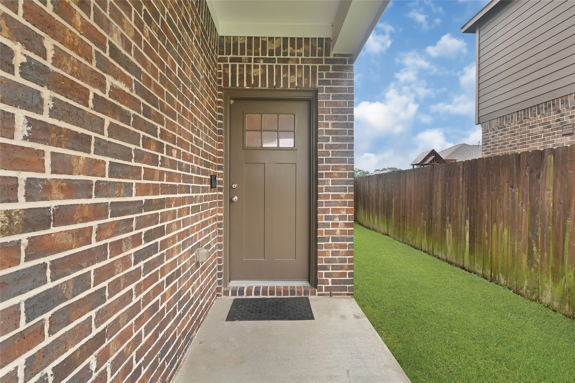 11346 Cascading Stream Way Houston, TX 77044 - Photo 3 of 24 a view of a door and brick wall