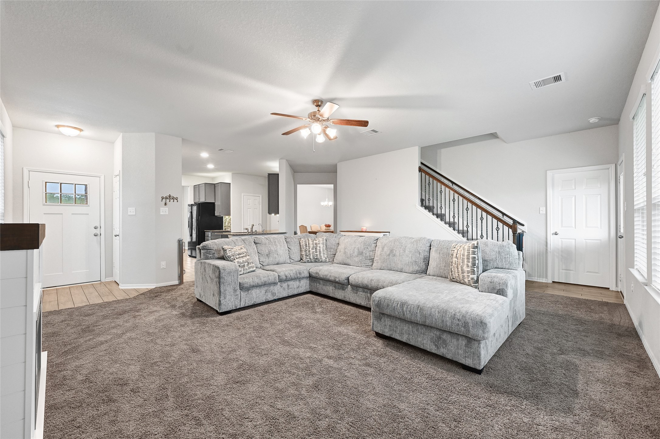 11346 Cascading Stream Way Houston, TX 77044 - Photo 4 of 24 a living room with furniture and a chandelier