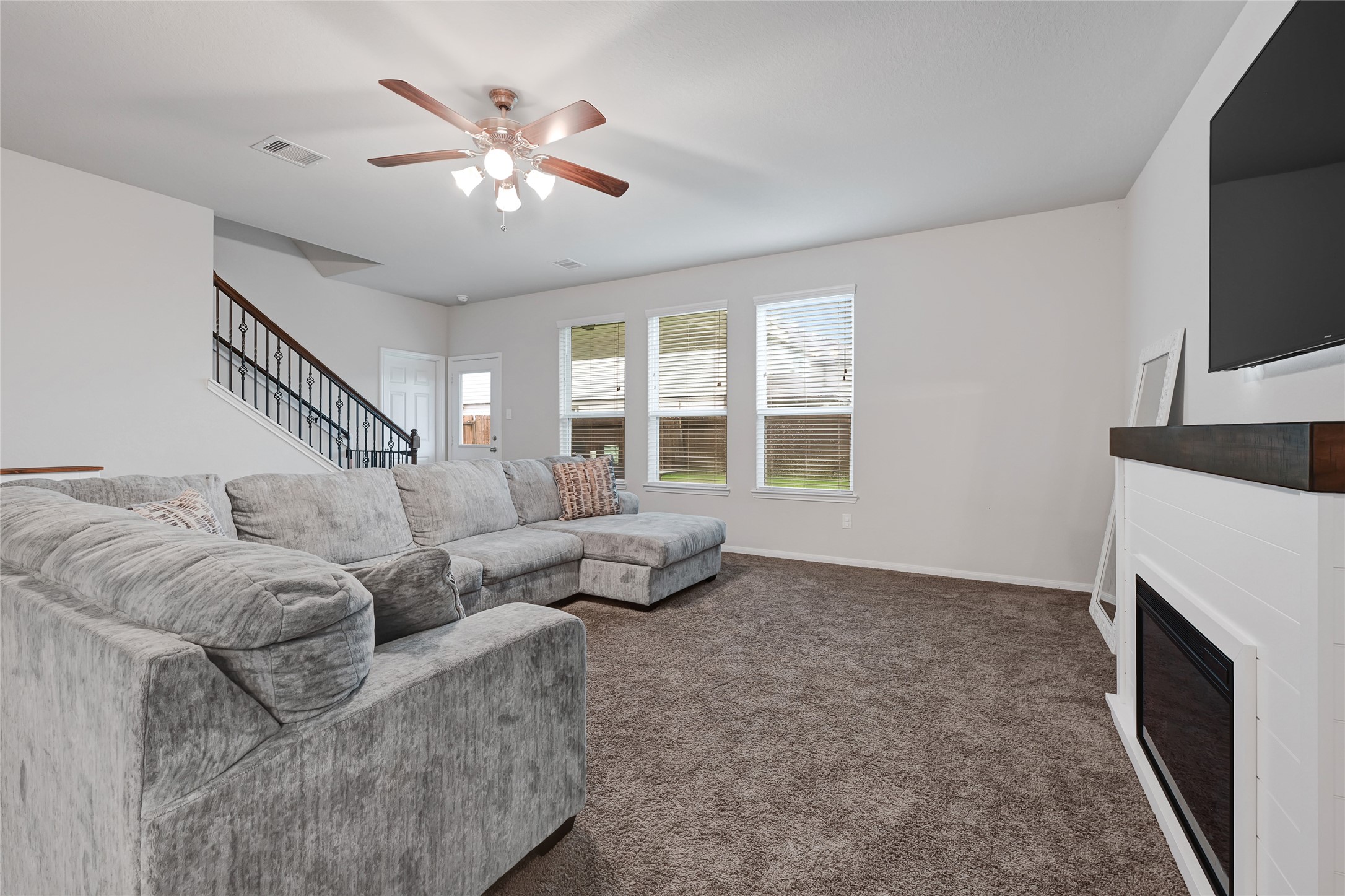 11346 Cascading Stream Way Houston, TX 77044 - Photo 5 of 24 a living room with furniture and a fireplace