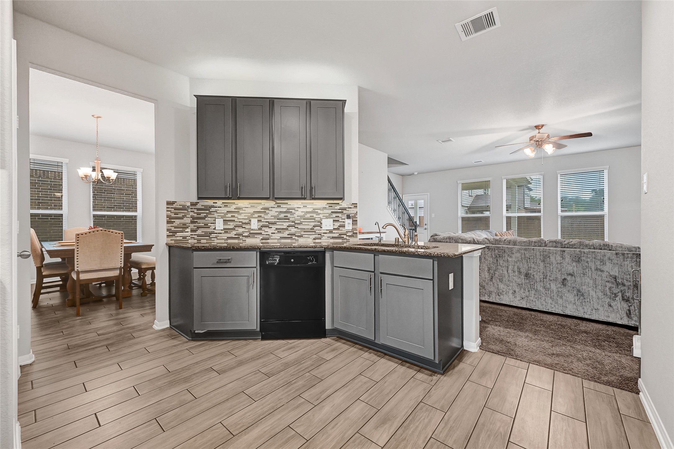 11346 Cascading Stream Way Houston, TX 77044 - Photo 7 of 24 a kitchen with stainless steel appliances granite countertop a stove and cabinets