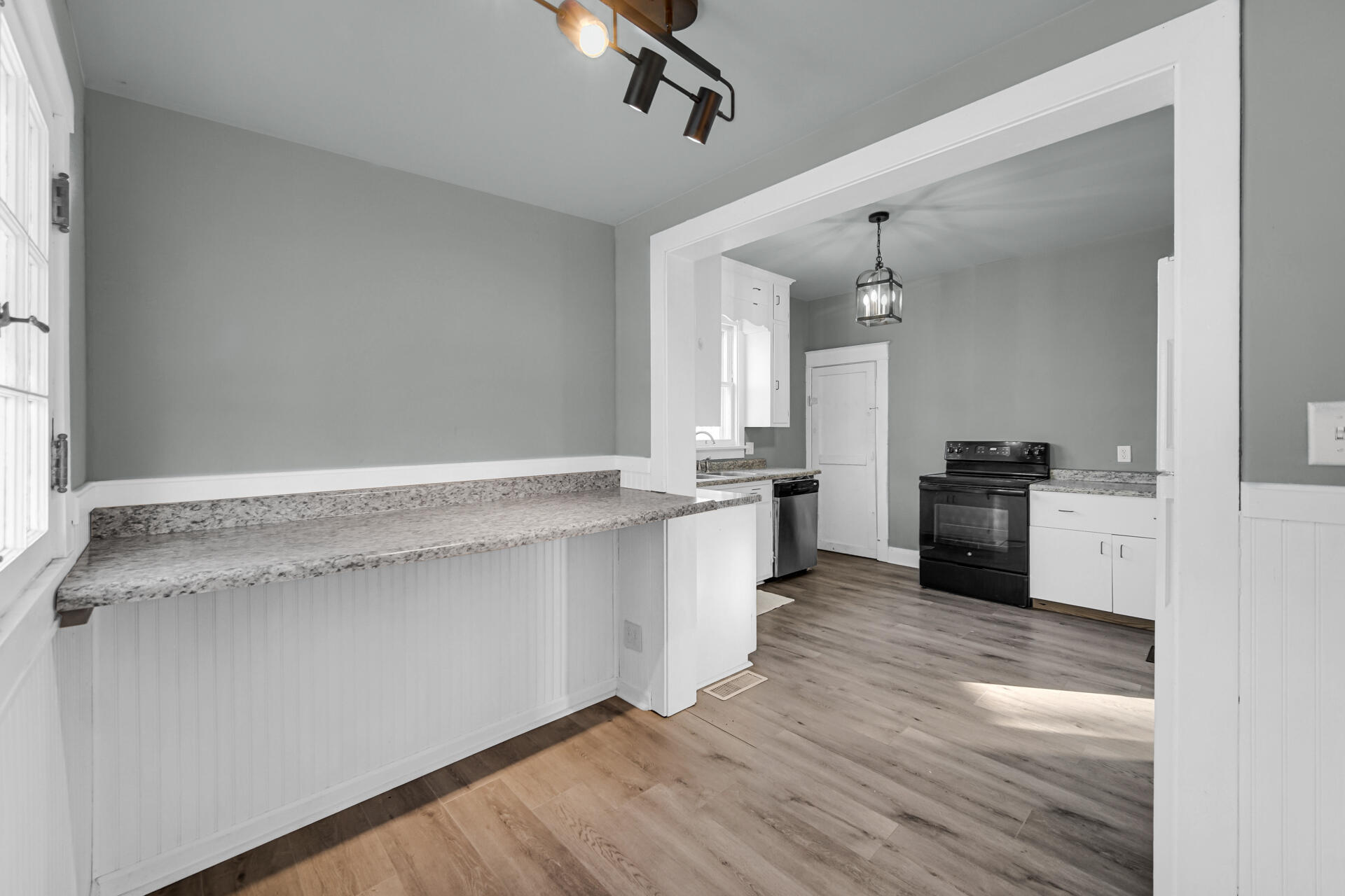 404 F Street La Porte, IN 46350 - Photo 18 of 35 a view of a kitchen with a sink and wooden floor