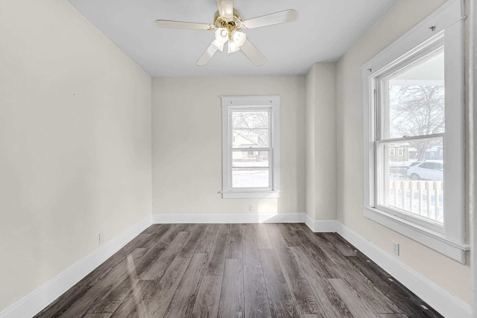 404 F Street La Porte, IN 46350 - Photo 24 of 35 wooden floor in an empty room with a window