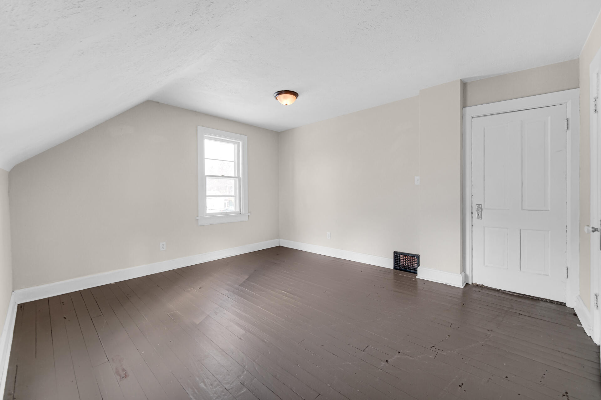 404 F Street La Porte, IN 46350 - Photo 30 of 35 an empty room with wooden floor and windows