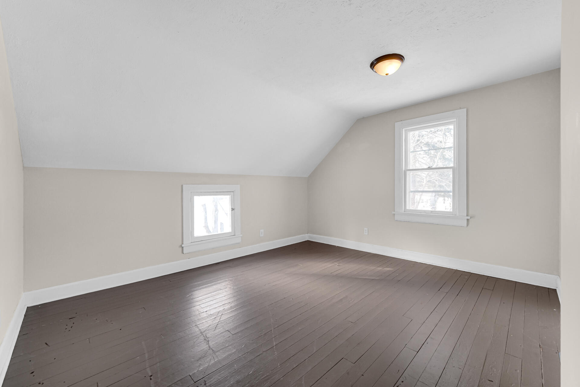 404 F Street La Porte, IN 46350 - Photo 31 of 35 an empty room with wooden floor and windows