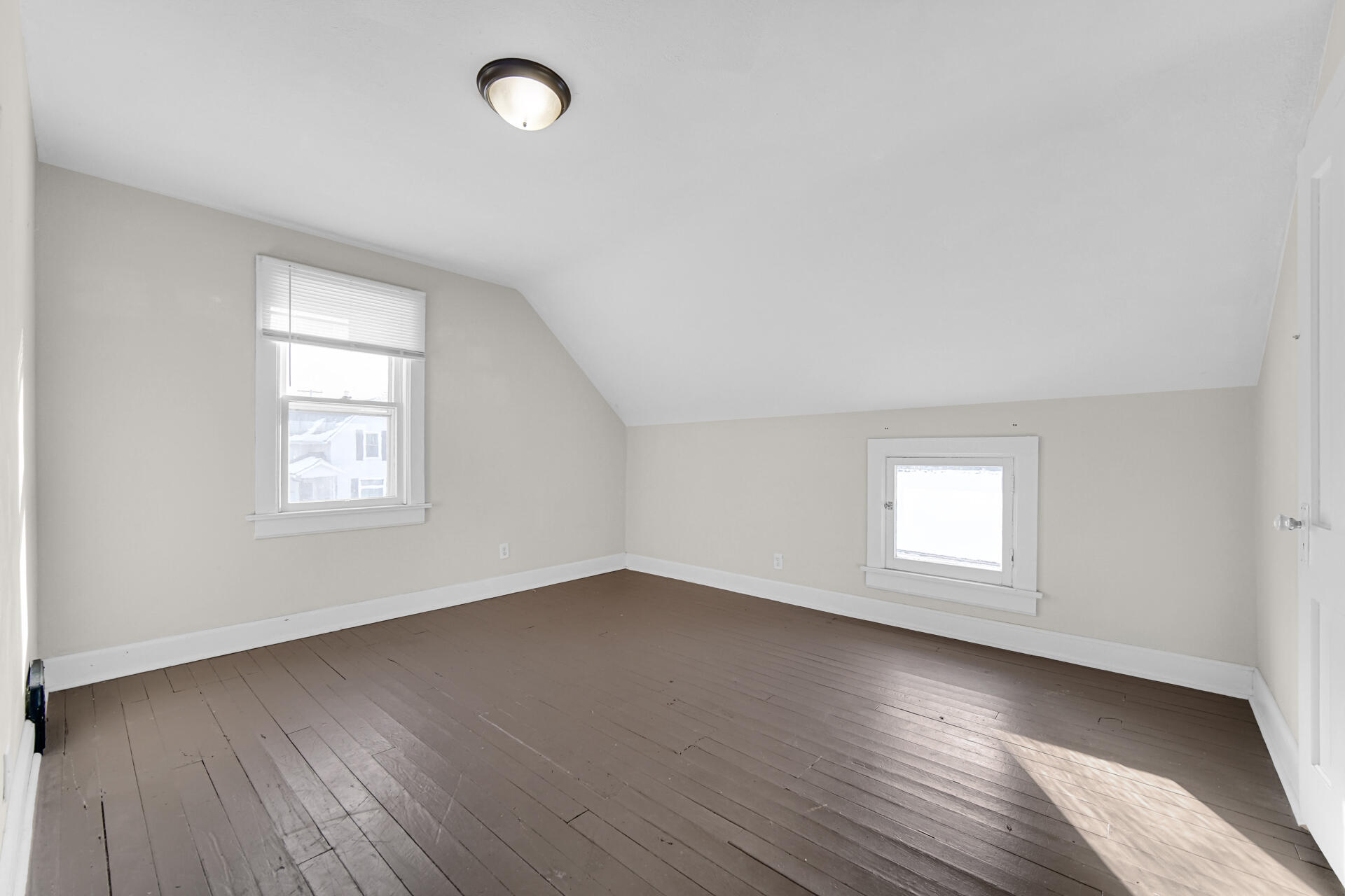 404 F Street La Porte, IN 46350 - Photo 32 of 35 an empty room with wooden floor and windows