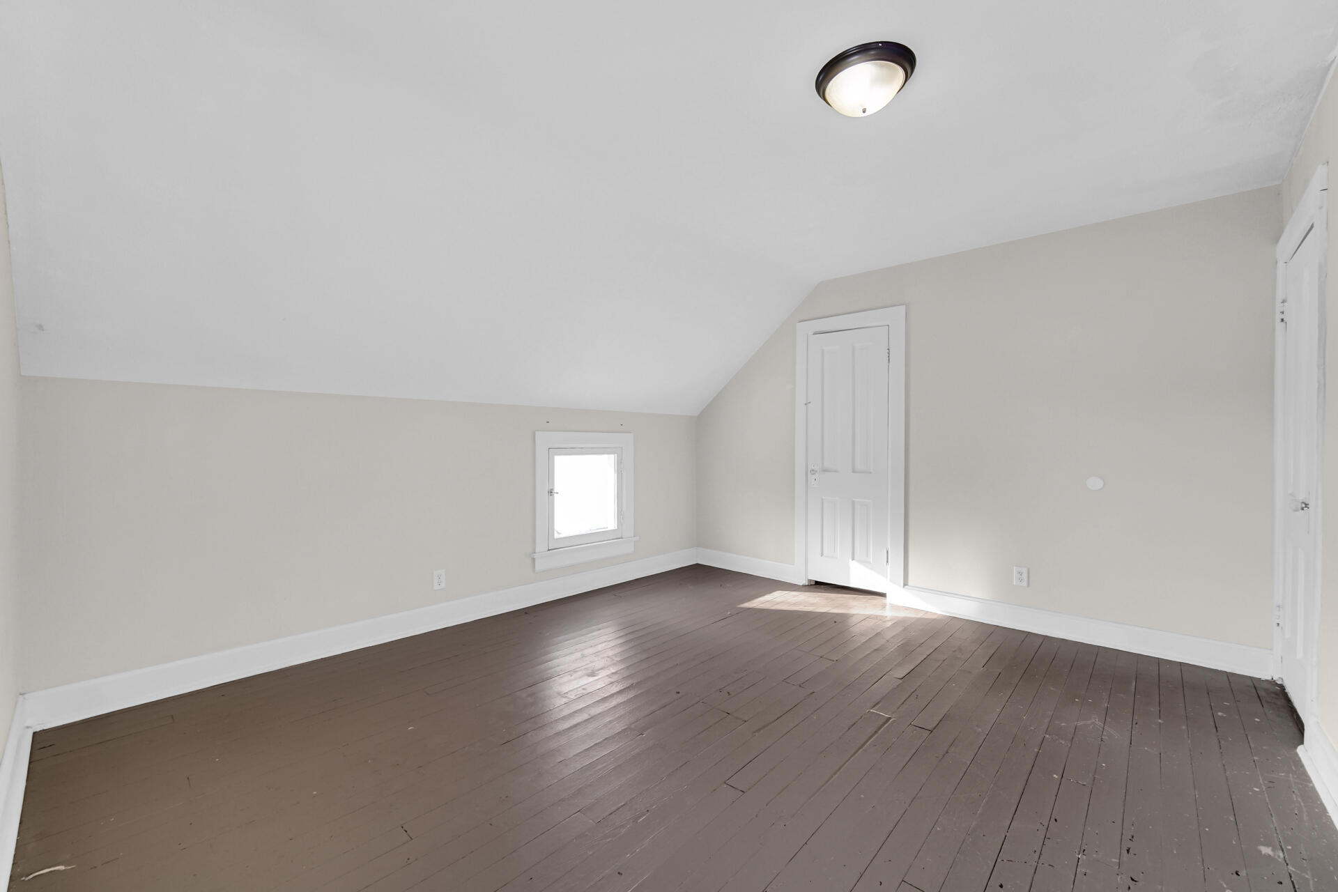 404 F Street La Porte, IN 46350 - Photo 33 of 35 an empty room with wooden floor and windows