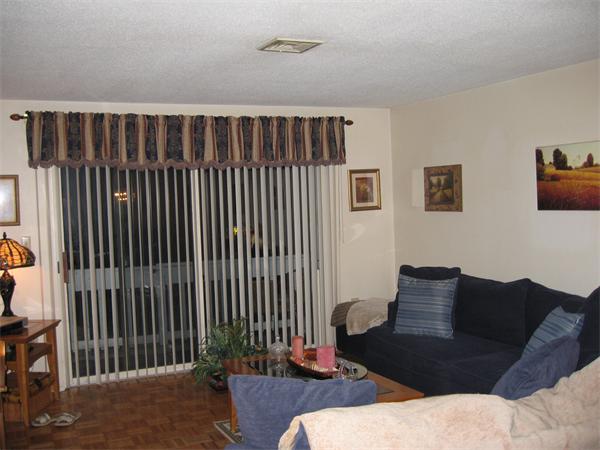 a living room with furniture lamp and rug