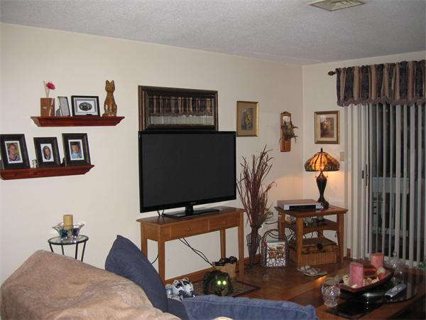 15 Bower Road, Unit B2 Quincy, MA 02169 - Photo 2 of 10 a living room with furniture and a flat screen tv