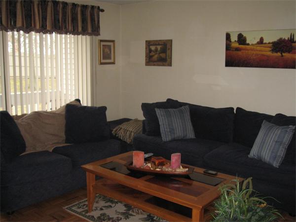 15 Bower Road, Unit B2 Quincy, MA 02169 - Photo 9 of 10 a living room with furniture and a window